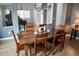 Formal dining room with hardwood floors and view of grand piano at 6588 S Sheridan Loop, Littleton, CO 80123