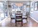 Bright dining room with hardwood floors and glass table at 6588 S Sheridan Loop, Littleton, CO 80123