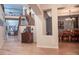 Elegant entryway with hardwood floors, staircase, and views to living and dining areas at 6588 S Sheridan Loop, Littleton, CO 80123