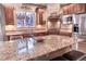 Spacious kitchen featuring granite countertops and stainless steel appliances at 6588 S Sheridan Loop, Littleton, CO 80123