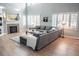 Spacious living room with hardwood floors, fireplace, and large windows at 6588 S Sheridan Loop, Littleton, CO 80123