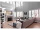 Spacious living room with hardwood floors, fireplace, and large windows at 6588 S Sheridan Loop, Littleton, CO 80123