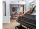 Grand piano in formal dining room with view of entryway at 6588 S Sheridan Loop, Littleton, CO 80123