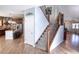 Stylish staircase with wrought-iron balusters and hardwood flooring at 6588 S Sheridan Loop, Littleton, CO 80123