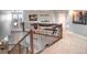 Upstairs hall with carpeted floor and shuffleboard table at 6588 S Sheridan Loop, Littleton, CO 80123