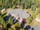 Stunning aerial view of a secluded home, showcasing its grand roofline and expansive driveway at 26886 Evergreen Springs Rd, Evergreen, CO 80439