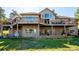The backyard features a large deck with mountain views and a well-maintained yard at 26886 Evergreen Springs Rd, Evergreen, CO 80439