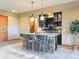 Modern basement bar featuring stone base, pendant lighting and modern appliances at 26886 Evergreen Springs Rd, Evergreen, CO 80439