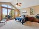 Primary bedroom with vaulted ceilings, balcony access and scenic views at 26886 Evergreen Springs Rd, Evergreen, CO 80439