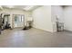 Spacious garage featuring a work out area with machines and an utility sink at 26886 Evergreen Springs Rd, Evergreen, CO 80439
