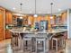 Gourmet kitchen featuring a large island with seating and high-end stainless steel appliances at 26886 Evergreen Springs Rd, Evergreen, CO 80439