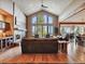Spacious living room with vaulted ceilings, a fireplace, and scenic views of the outdoors at 26886 Evergreen Springs Rd, Evergreen, CO 80439
