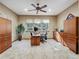 Home office with neutral carpet, ceiling fan and expansive storage cabinets at 26886 Evergreen Springs Rd, Evergreen, CO 80439