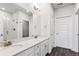 Double vanity bathroom with a large mirror and separate shower at 487 Interlocken Blvd # 304, Broomfield, CO 80021