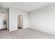 Bright bedroom with window and neutral carpeting, near bathroom at 487 Interlocken Blvd # 304, Broomfield, CO 80021