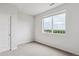 Bedroom with window offering an outdoor view and neutral carpet at 487 Interlocken Blvd # 304, Broomfield, CO 80021