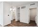 Bright dining area with wood floors, built-in shelving, and laundry area at 487 Interlocken Blvd # 304, Broomfield, CO 80021