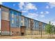 Modern apartment building with brick and blue accents, offering parking and mailboxes at 487 Interlocken Blvd # 304, Broomfield, CO 80021