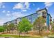 Contemporary apartment building, featuring a mix of blue and brick at 487 Interlocken Blvd # 304, Broomfield, CO 80021