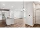 Modern kitchen with island, stainless steel appliances, and hardwood floors at 487 Interlocken Blvd # 304, Broomfield, CO 80021