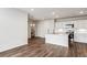 Modern kitchen with island and stainless steel appliances, open to the living area at 487 Interlocken Blvd # 304, Broomfield, CO 80021