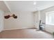 Finished basement with neutral carpeting, white walls, and modern lighting fixtures at 1026 Deer Clover Way, Castle Pines, CO 80108