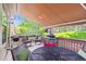 Spacious deck with awning, multiple seating areas, and great backyard views at 1026 Deer Clover Way, Castle Pines, CO 80108