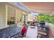 Outdoor deck features an awning and furniture with grill at 1026 Deer Clover Way, Castle Pines, CO 80108