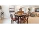 Basement dining area featuring wood table with four chairs, recessed lighting, and artwork at 1026 Deer Clover Way, Castle Pines, CO 80108