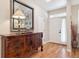 Welcoming entryway featuring hardwood floors and a decorative console table with elegant accents at 1026 Deer Clover Way, Castle Pines, CO 80108