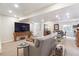 Basement living room featuring modern sofa, wood accents, recessed lighting, and neutral carpet at 1026 Deer Clover Way, Castle Pines, CO 80108