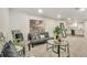 Cozy, finished basement living area with stylish seating, modern decor, and easy access to the kitchenette at 3550 Eudora St, Denver, CO 80207