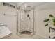 Modern renovated bathroom with a walk-in shower with stylish tile, glass enclosure, and a vessel sink on the vanity at 3550 Eudora St, Denver, CO 80207