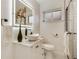 Modern bathroom features a vessel sink, lighted mirror, and a sleek glass-enclosed shower at 3550 Eudora St, Denver, CO 80207