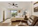 Bright bedroom featuring a cozy chair, balcony and hardwood floors at 3550 Eudora St, Denver, CO 80207