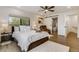 Charming bedroom featuring luxury vinyl flooring, en suite bath and a cozy chair at 3550 Eudora St, Denver, CO 80207