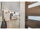 Inviting entryway leading to a modern kitchen with an island and stainless steel appliances at 3550 Eudora St, Denver, CO 80207