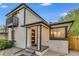 Charming home featuring a balcony, freshly painted exterior and updated front door at 3550 Eudora St, Denver, CO 80207