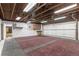 Spacious garage with painted floor, overhead storage, and room for multiple vehicles at 3550 Eudora St, Denver, CO 80207