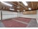 Spacious garage with painted floor, overhead storage, and room for multiple vehicles at 3550 Eudora St, Denver, CO 80207