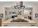 Bright, open kitchen with modern stainless steel appliances, marble countertop island and open view to dining area at 3550 Eudora St, Denver, CO 80207