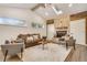 Inviting living room with high vaulted ceilings, skylight, fireplace, wood accents, and comfortable seating arrangement at 3550 Eudora St, Denver, CO 80207