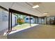 Covered patio features lights and access to the backyard and rec room at 3550 Eudora St, Denver, CO 80207