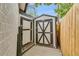 Outdoor view of storage sheds with painted doors and hardware in backyard at 3550 Eudora St, Denver, CO 80207