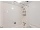 Shower stall with tile surround and storage shelf at 1433 N Williams St # 801, Denver, CO 80218