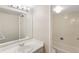 Clean bathroom with single sink vanity and bathtub shower at 1433 N Williams St # 801, Denver, CO 80218