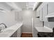 Well-lit kitchen with white counters, grey cabinets, and a modern faucet at 1433 N Williams St # 801, Denver, CO 80218