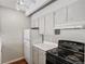 Modern kitchen with gray cabinets and efficient appliances at 1433 N Williams St # 801, Denver, CO 80218