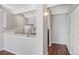 Galley kitchen with gray cabinets and a breakfast bar at 1433 N Williams St # 801, Denver, CO 80218