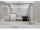 Simple kitchen with white countertops and gray cabinets at 1433 N Williams St # 801, Denver, CO 80218